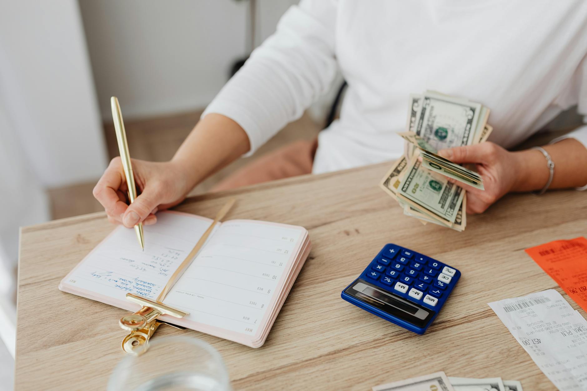 A clean editorial debt payoff scene with payment and balance visuals